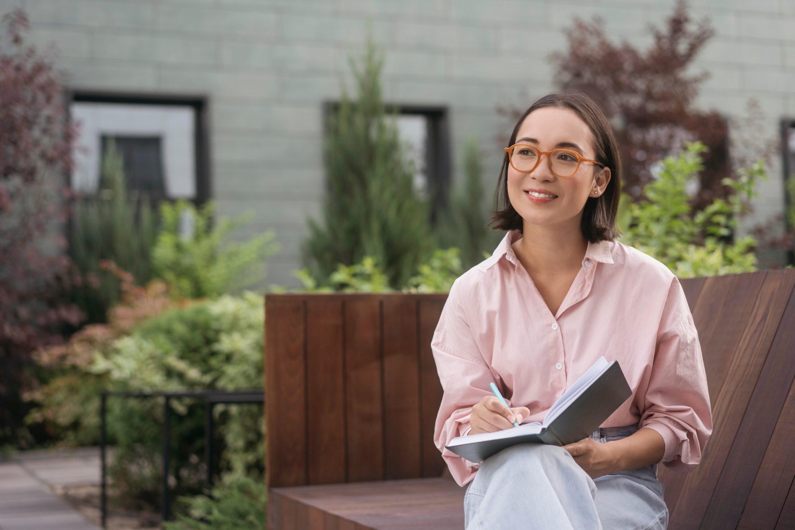 Portrait Of Confident Smiling Asian Writer